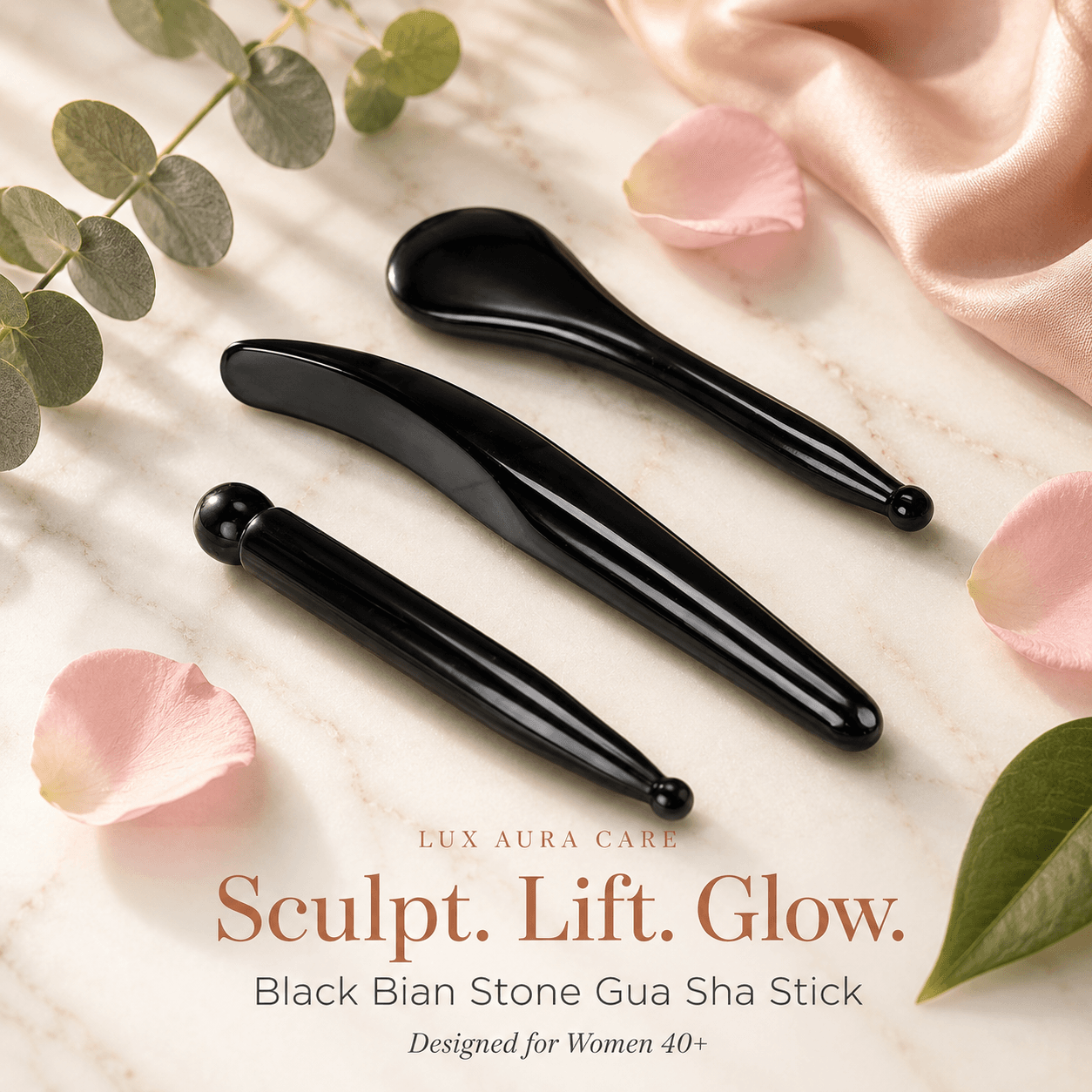 Black Bian Stone Gua Sha facial massage stick on dark marble surface