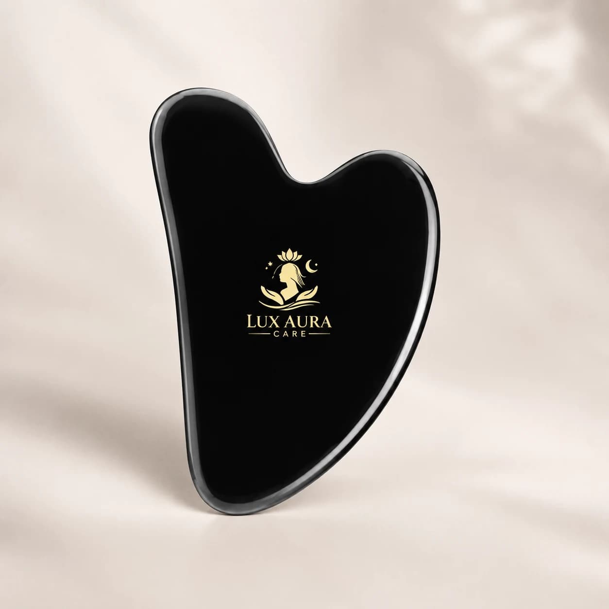 Lux Aura Care black gloss gua sha with gold logo